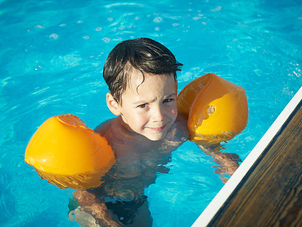 istock Children swimming in the pool 162489081