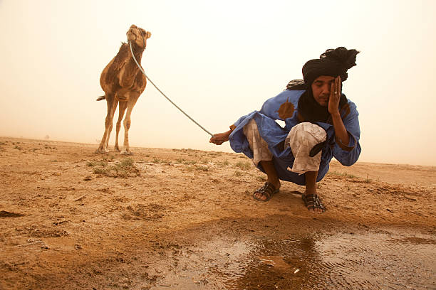 Sahara Desert, Morocco Nomadic person is washing his face on Sahara Desert, Morocco. desert wash stock pictures, royalty-free photos & images