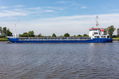 Hörsten, Germany - June 14, 2021: general cargo ship Baltic Sailor in the Kiel Canal