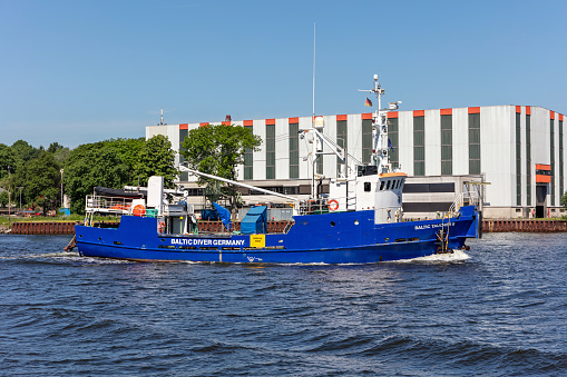Osterönfeld, Germany - June14, 2021: diving vessel Baltic Taucher II in the Kiel Canal