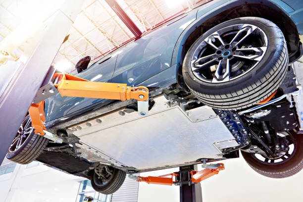 istock Electro car on lift in car service 1624908665