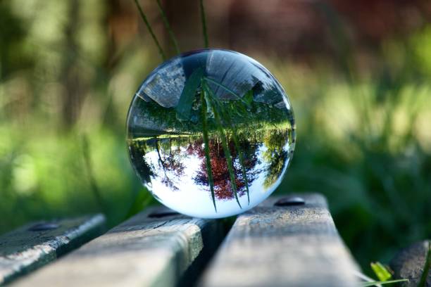 istock Crystal ball on wooden bench 1624913456