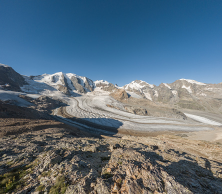 Panoramic aerial view of two sweeping glaciers merging near Kennecott in Wrangell - St Elias National Park