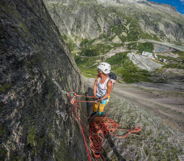 istock Woman rock climbing multi pitch route in the Alps 1624925665