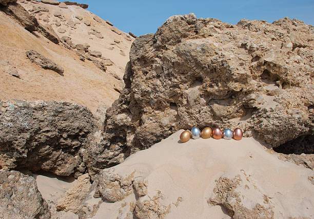 Easter Eggs on a rocky cliff stock photo