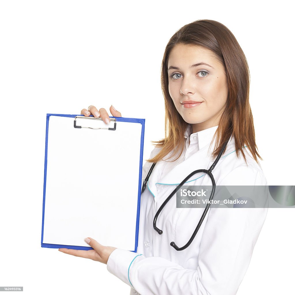 female doctor showing a blank paper sheet on clipboard isolated Portrait of young female doctor showing a blank paper sheet on clipboard isolated on white background Adult Stock Photo