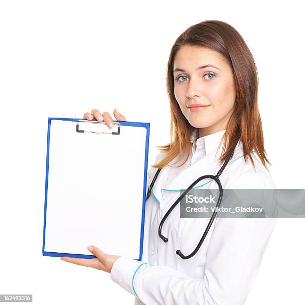 Female Doctor Showing A Blank Paper Sheet On Clipboard Isolated Stock Photo - Download Image Now