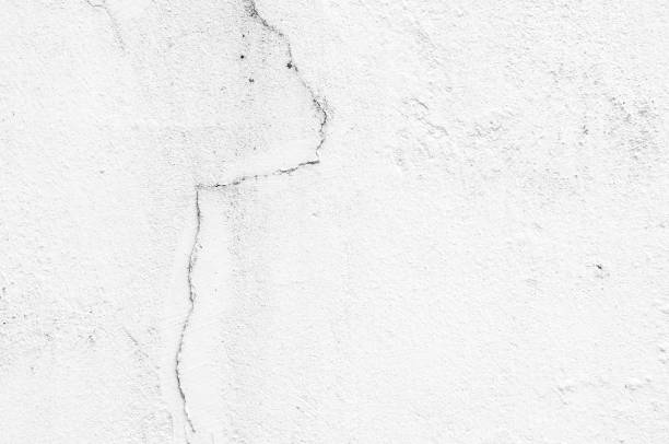 istock white cement; texture stone concrete,rock plastered stucco wall; painted flat fade pastel background grey solid floor grain.Rough top beige empty brushed print sand brick sepia grunge crack home dirty 1624947849