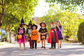 Kids trick or treat. Halloween fun for children.