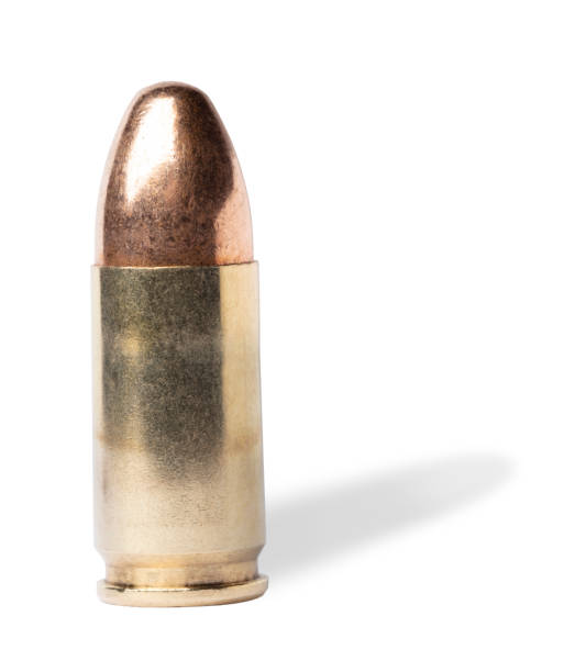 istock Shadow behind a 9 mm pistol cartridge 1624963942