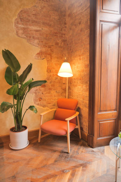istock a lamp and a chair in home against wall 1624969268