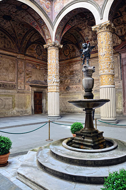 Porphyry Fountain (Putto with Dolphin) Porphyry Fountain by Verrocchio(c. 1435- fountain courtyard villa italian culture stock pictures, royalty-free photos & images