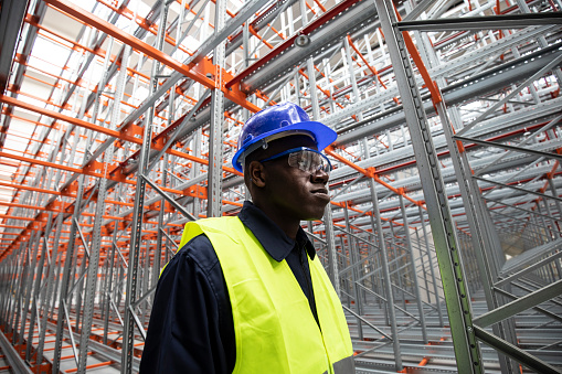 Portrait of young afro worker in a warehouse