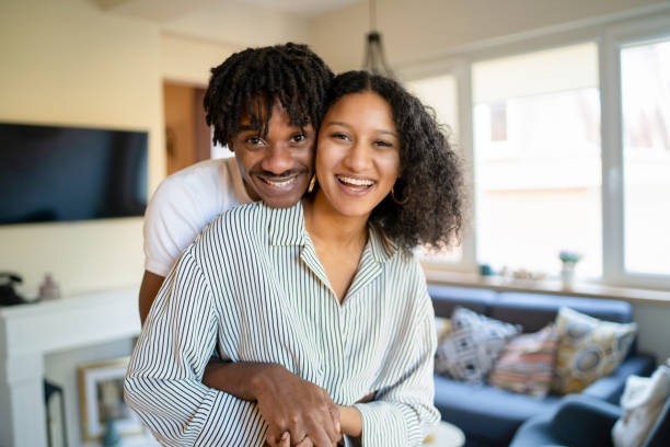 istock A couple smiling as they cuddle playfully 1625019918
