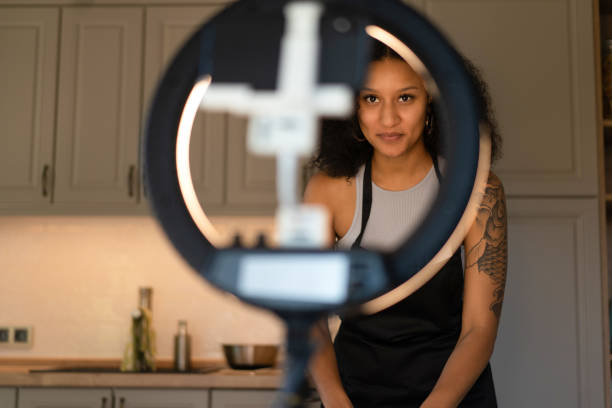 istock A close of up a LED light ring with a female vlogger behind 1625034154