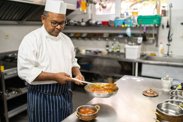 istock An Indian chef cooking in a kitchen 1625037269