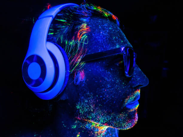 istock A DJ with headphones under UV lights 1625046861