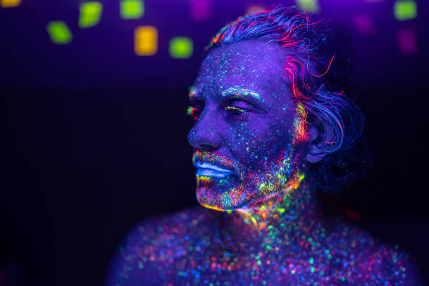 istock Portrait of a man's face under UV lights 1625046862