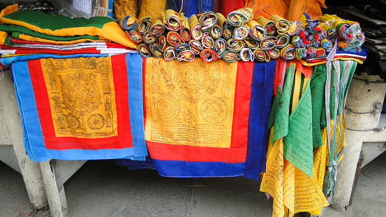 Tibet, China - Sep 8, 2012. Selling praying flags at a shop in Lhasa, Tibet. The centre of the Tibetan Buddhist world for over a millennium, Lhasa remains largely a city of wonders.