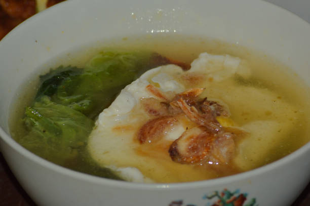 istock Close-up View Homemade Poached Eggs Soup In A Cup 1625058719