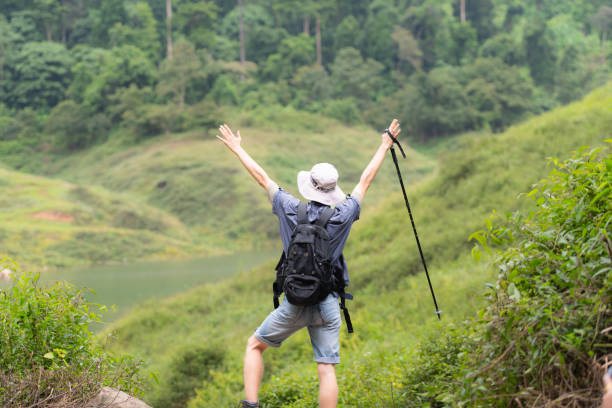 istock Young man with backpack hiking in the forest. Active lifestyle concept. 1625094399