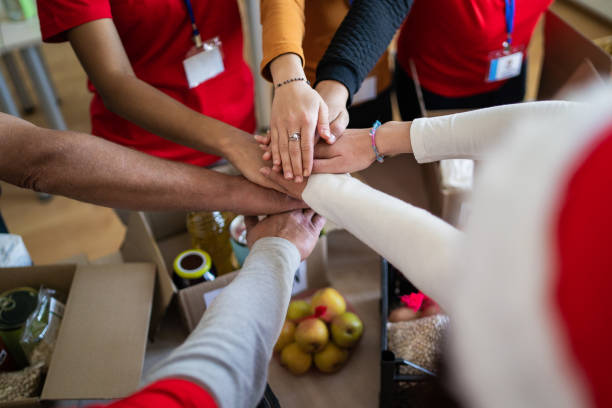 Close up of a circle of stacked hands