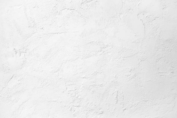 istock White cement textured wall concrete stone background. White texture wall background 1625118733