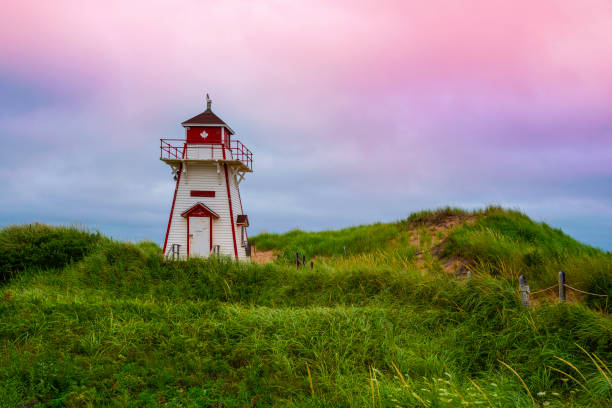 Covehead Harbour Lighthouse in York, Prince Edward Island National Park, Canada Covehead Harbour Lighthouse in York, Prince Edward Island National Park, Canada cavendish beach at prince edward island national park canada stock pictures, royalty-free photos & images