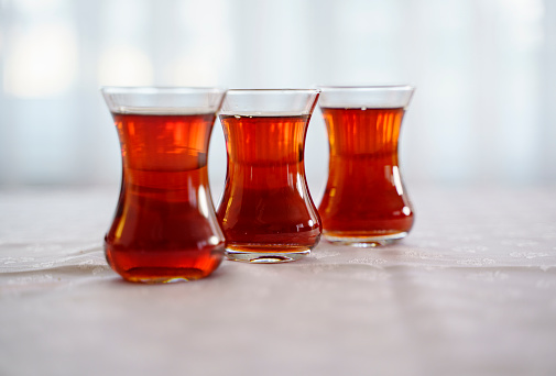 Three glasses of Turkish tea on a table