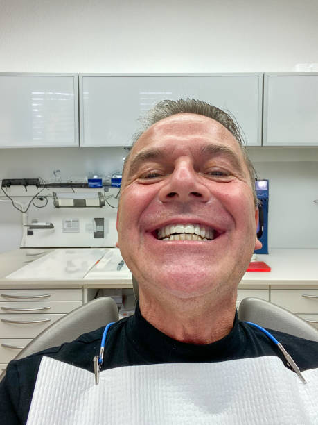 istock Front view of a man showing his new teeth 1625144031