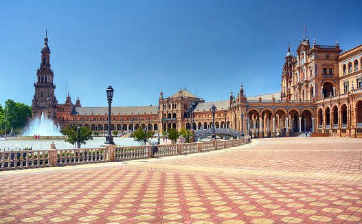 The Plaza de Espana, built in 1928, is a plaza in the Parque de Maria Luisa in Seville, Spain
