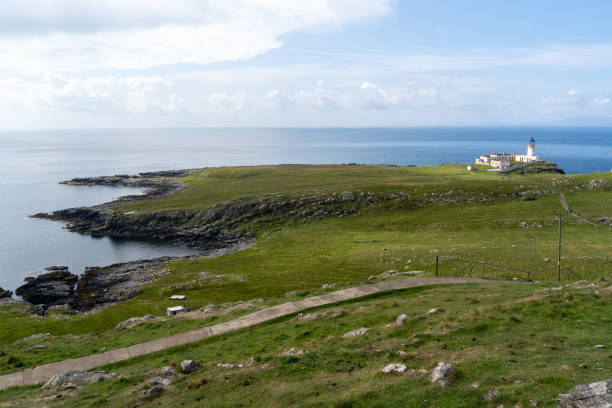 istock White lighthouse on the coast by the ocean 1625169812
