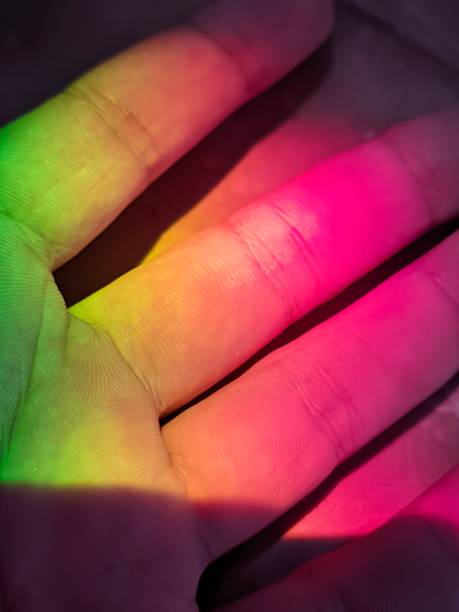 istock Closeup of a palm with rainbow light effect highlights 1625213892