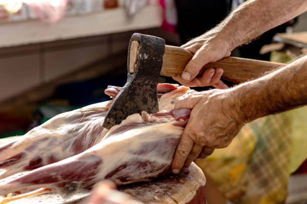 Butcher's hands with an ax