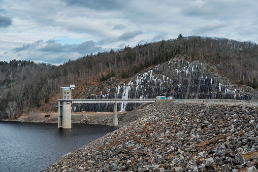 The landmark Colebrook River Lake Dam in Connecticut during a new england winter.