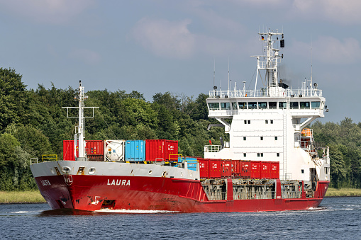 Sehestedt, Germany - June 19, 2021: general cargo vessel Laura in the Kiel Canal