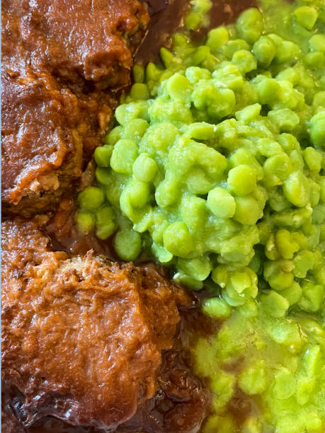 istock Full frame image of faggots (offal meatballs), mushy peas and gravy meal, elevated view 1625280557