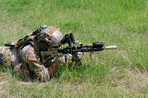 Soldier in civil war, ruin building. Close quarter battle and civil war concept.