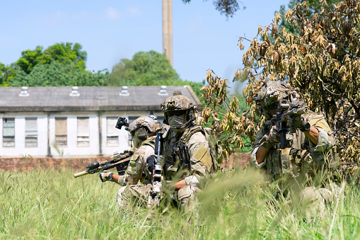 Szolnok, Hungary - August 18, 2022: Hungarian Defence Forces. Spec Ops soldier with carbine. Counter terrorism. Military unit. Special operation on the water with boat.