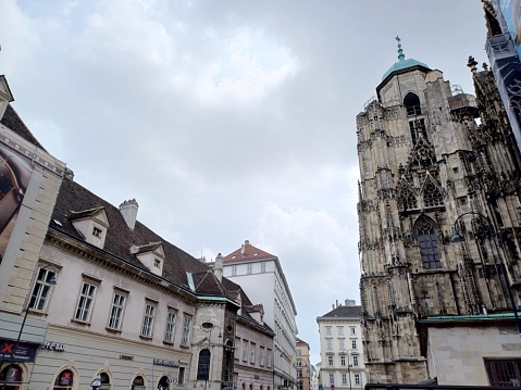 Vienna, Austria - June 8, 2023: View of St. Stephen's Cathedral and buildings on Stephansplatz square, Vienna city, Austria.