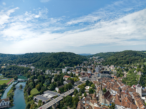 Aerial view of Swiss City of Baden with Limmat Rive, old town and bridge on a sunny summer noon. Photo taken August 19th, 2023, Baden, Canton Aargau, Switzerland.