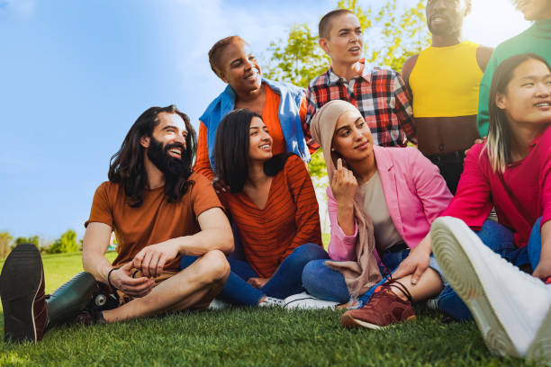 istock Diverse group of people having fun together at summer party outdoors - Happy multicultural friends outside city park 1625310678