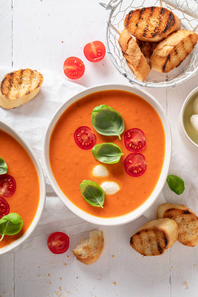 istock Creamy tomato soup with mozzarella cheese and crostini. 1625312368