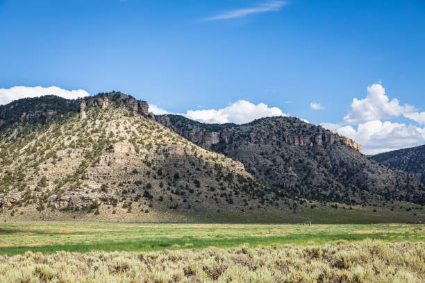 istock An arid landscape under partly cloudy skies with distant mountains 1625313819