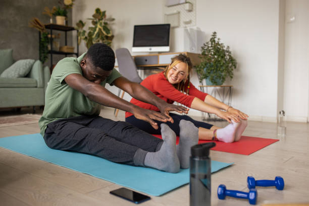 istock Couple exercising together at home 1625321863