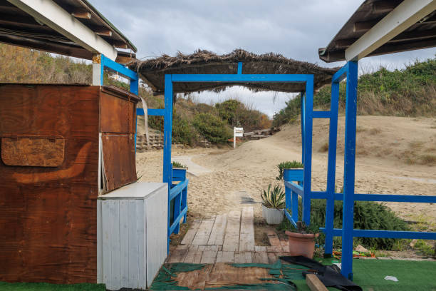 Wood Building Built on the Beach, Deserted and Desolate Beach in Winter Time