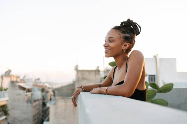 istock African woman posing on a rooftop 1625330473