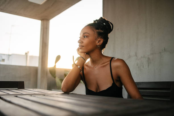 istock African woman at a rooftop deck 1625331016