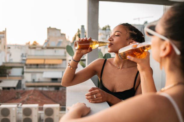 istock Female friends drinking beer 1625332587