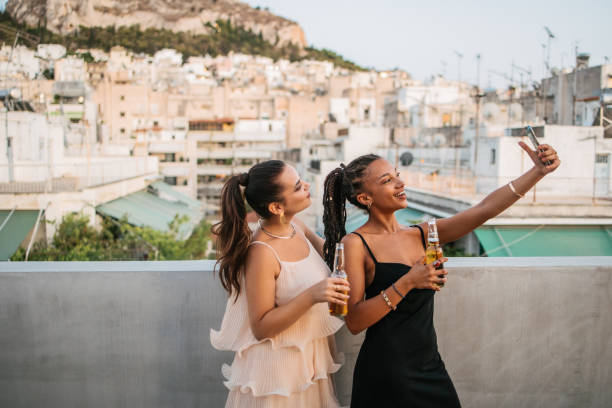 Taking selfie on a rooftop stock photo